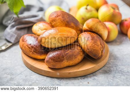 Ready-made Baked Pies (pirogi) With Apple. Traditional Russian Cuisine. Ready-made Baked Pies
