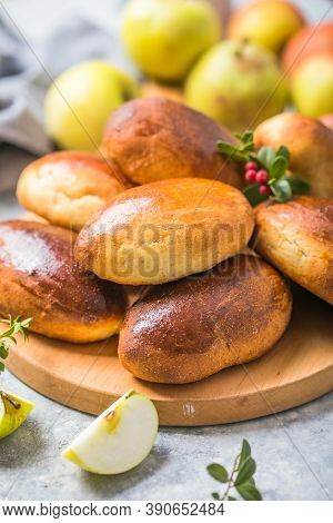 Ready-made Baked Pies (pirogi) With Apple. Traditional Russian Cuisine.