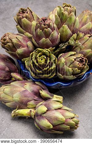 Fresh French Petit Violet Artichokes Heads Cultivted In Brittany, France