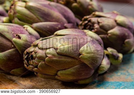 Fresh French Petit Violet Artichokes Heads Cultivted In Brittany, France