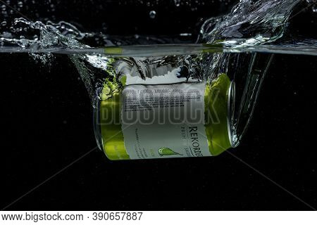 Close Up View Of Can Falling In Water. Pear Sider. Sweden. Uppsala. 10.19.2020.
