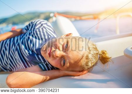 Little Boy On Board Of Sailing Yacht On Summer Cruise. Travel Adventure, Yachting With Child On Fami