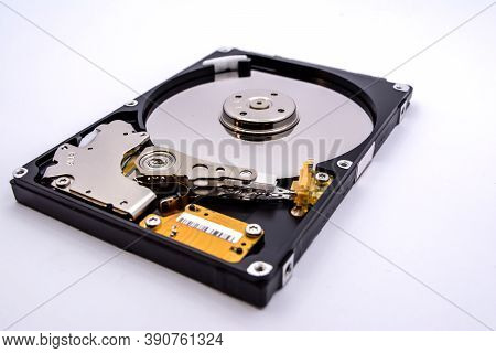 Internal Parts Of A Hard Disk Isolated On A White Background. Close Up Of Hard Disk Drive Inside Vie