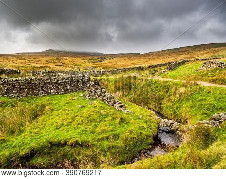 Dry Stone Walls And Open Moorland With Stream. Nidderdale. Yorkshire Dales National Park