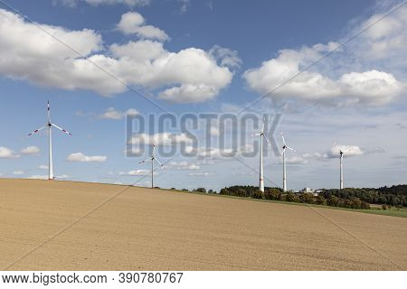 Wind Farm In The Taunus Region With Plowed Fields