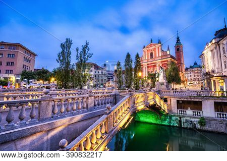 Ljubljana City Center At Dusk Overlooking The Triple Bridge And Beautiful Franciscan Church, Sloveni