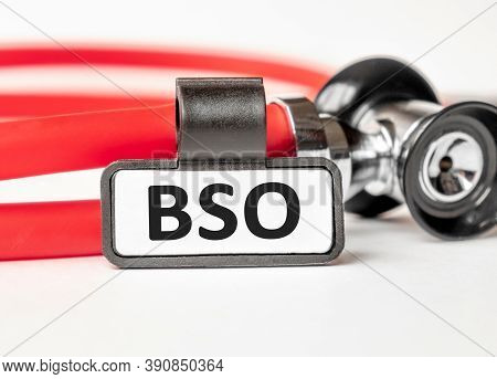 Bph Benign Prostatic Hyperplasia Lettering On A Business Card With A Holder, Next To The Red Stethos