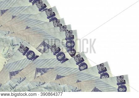 100 Philippine Piso Bills Lies Isolated On White Background With Copy Space Stacked In Fan Close Up