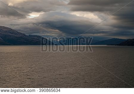 Sarmiento Channel, Chile - December 11, 2008: Amalia Glacier And Fjord. Multi-layer Cloudscape Over 