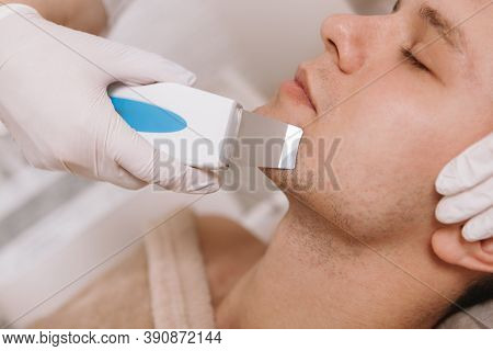 Closeup Cropped Shot Of A Young Man Having Ultrasound Facial Cleansing Procedure At Cosmetology Clin