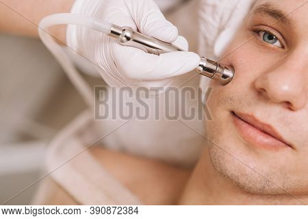Cropped Close Up Of A Young Man Having Facial Hardware Skincare Treatment By Professional Dermatolog