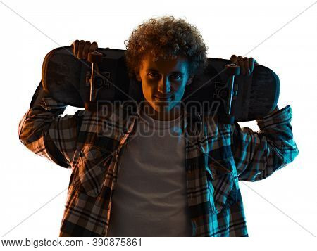 one cauacsian young man skateboarder Skateboarding in studio silhouette shadow isolated on white background