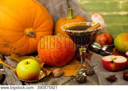 Autumn Fall Halloween Thanksgiving Season Special Martini Cocktail. A Photo Composition With Maple L
