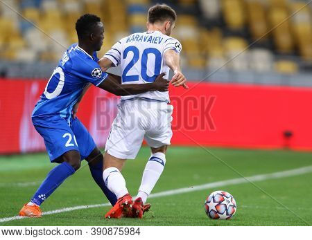 Kyiv, Ukraine - September 29, 2020: Osman Bukari Of Gent (l) Fights For A Ball With Oleksandr Karava