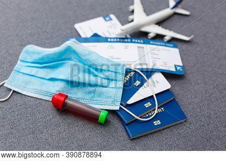 Coronavirus And Travel Concept. The Concept Of Restrictions For Tourism. Passport, Thermomether And 
