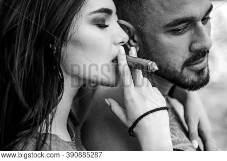 Cuban Cigar. Sensual Latino Couple. Latin Men Enjoing And Relaxing With Love Women. Couple Enjoy In 
