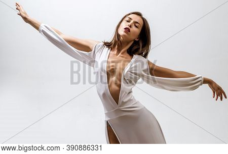 Beautiful Fairy Flying Girl In White Dress. Romantic Young Beauty As An Angel