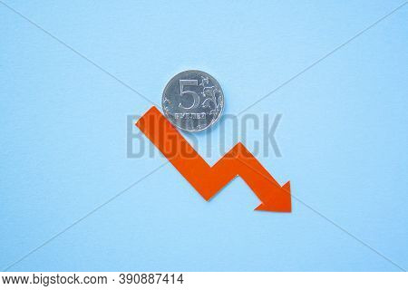 Five Rouble Coin On Blue Background With Red Arrow Down. Exchange Rate Chart. Ruble Depreciation. Ex
