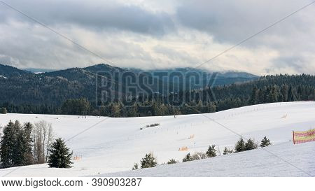 Panoramic Winter View Of Beskid Sadecki Mountains From Ski Slope In Krynica Zdroj, Poland
