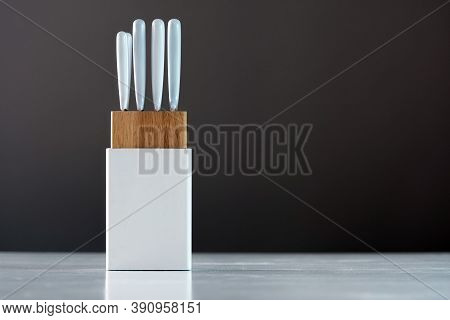 Kitchen Knife Set In White Holder On The White Table, Close-up
