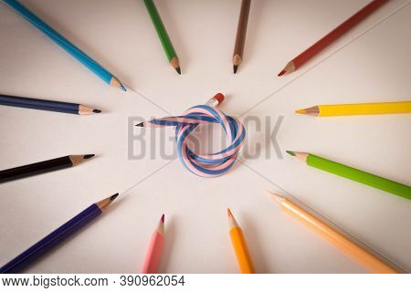 Flexible Pencil And A Set Of Colored Pencils On A Light Background. Selective Focus