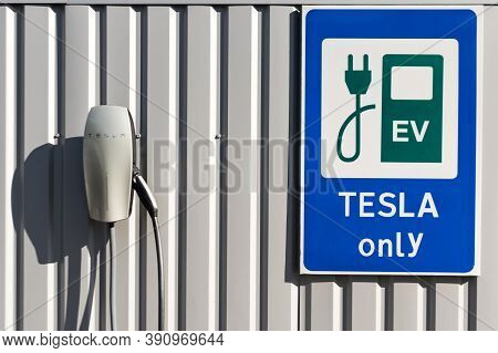 Kyiv, Ukraine - October 17, 2020: Tesla Vehicle Charging Only Sign Near The Charging Station Against