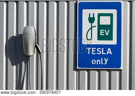 Kyiv, Ukraine - October 17, 2020: Tesla Vehicle Charging Only Sign Near The Charging Station Against