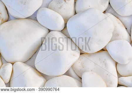 Background Of Roundish Stone, Close-up. Texture In The Form Of White Rocks. Texture Of Large White S