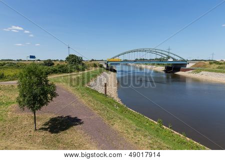 Iron Bridge Is Crossing A Canal In Germany