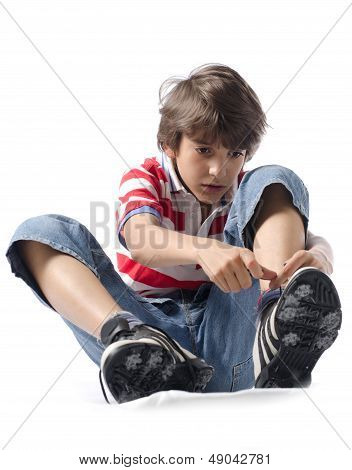 Child Putting On Sneakers