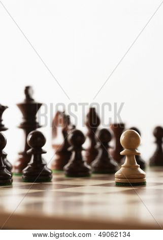 Chess game one white piece in front of black pieces