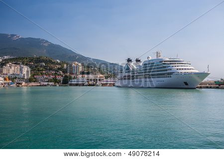 Big ship evening sailing off from Yalta port