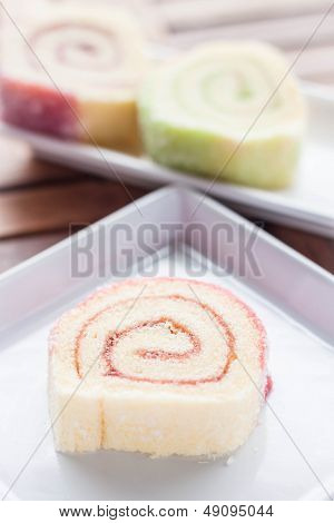Colorful Jam Rolls Served On Wood Table