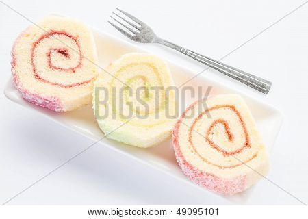 Dish Of Colorful Jam Roll Cakes With Fork