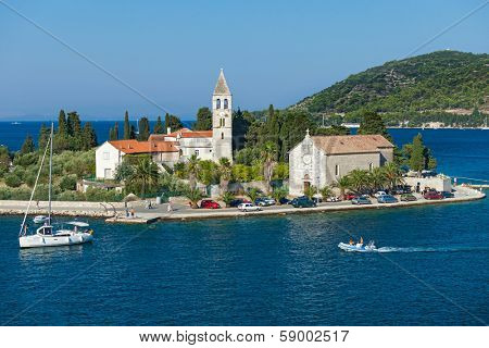VIS, CROATIA - AUGUST 19, 2012: St. Juraj church, the first sight which greets visitors to on arrival to Vis, the furthest Croatian inhabited island.