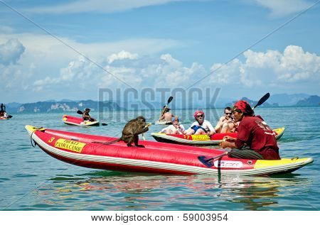 BANG TAO, THAILAND - MAY 15, 2013: Tourist canoe in Andaman Sea, May 15, 2013 in Bang Tao, Thailand. Every year 20 million tourists visit Thailand