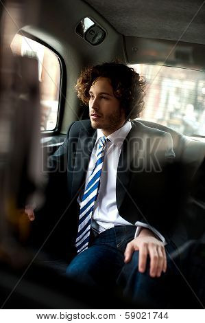 Handsome Business Executive Inside Taxi Cab