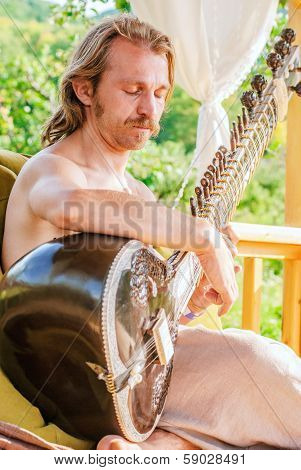 Man Playing On Indian Traditional Musical Instument - Sitar