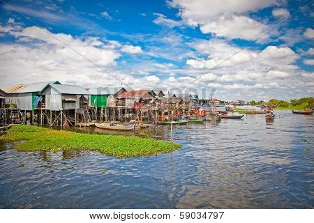 The floating village, caled Komprongpok, on the water of Tonle Sap lake. Cambodia.