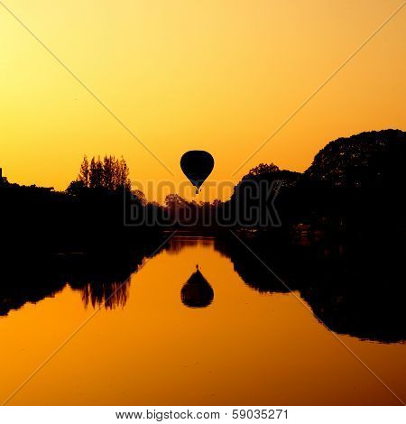 Hot Air Balloon At Sunrise On The River