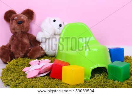 Green potty on home interior background