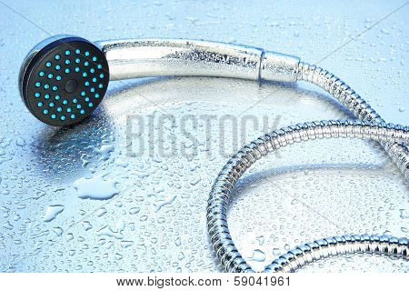 Shower and drops, on blue background 