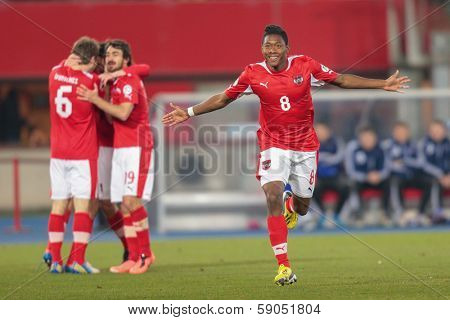 VIENNA,  AUSTRIA - MARCH 22 David Alaba (#8 Austria) celebrates a goal during the world cup qualifier game on March 22, 2013 in Vienna, Austria.