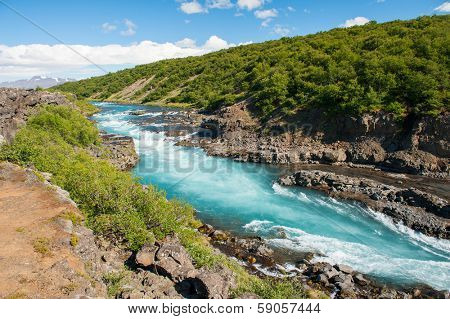 Hvita river with a incredibly blue water near Hraunfossar waterfalls, Iceland