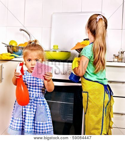 Children cleaning  kitchen. Housekeeping.