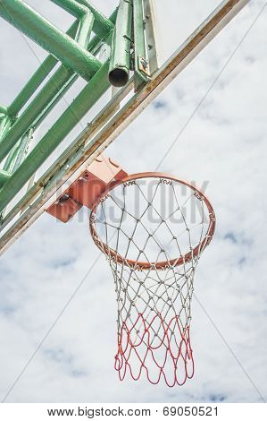 Red Basketball Hoop And White Cloud