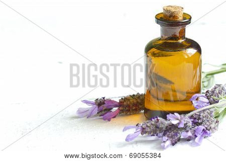 Lavender oil on white planks closeup