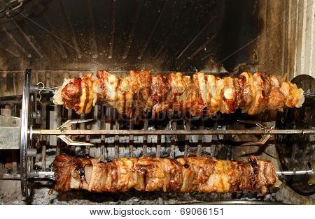 Meat Skewers Cooked To Spit In The Fireplace Swivel