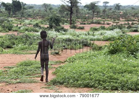 African Girl Goes On The Savannah