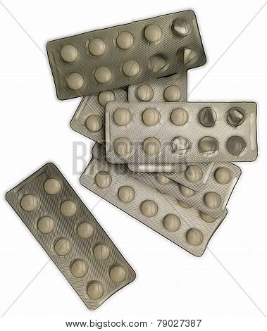 heap of medicine pills blister packs on a white background